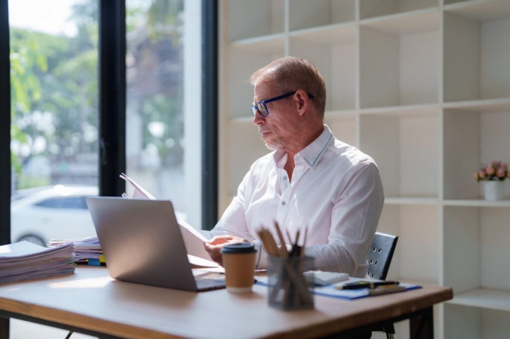 Case manager updating a client record during a transition between IDD program types